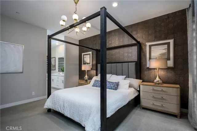 a bathroom with a granite countertop sink a mirror and a bathtub