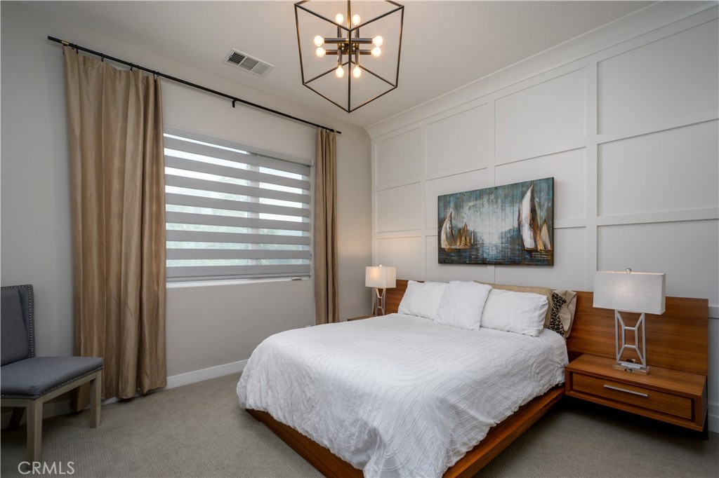 413 Transport Tustin, CA 92782 - Photo 23 of 47 a bedroom with a bed and window