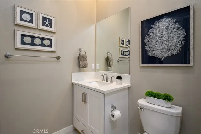 a white toilet sitting next to a bath tub shower