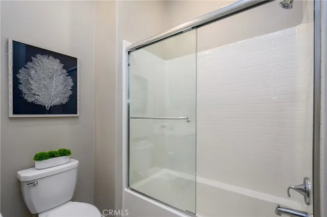 a kitchen with a sink a stove a refrigerator and cabinets