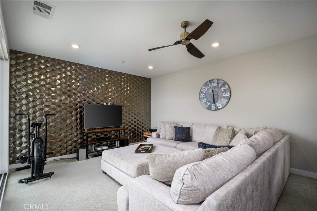 413 Transport Tustin, CA 92782 - Photo 32 of 49 a living room with furniture and a flat screen tv