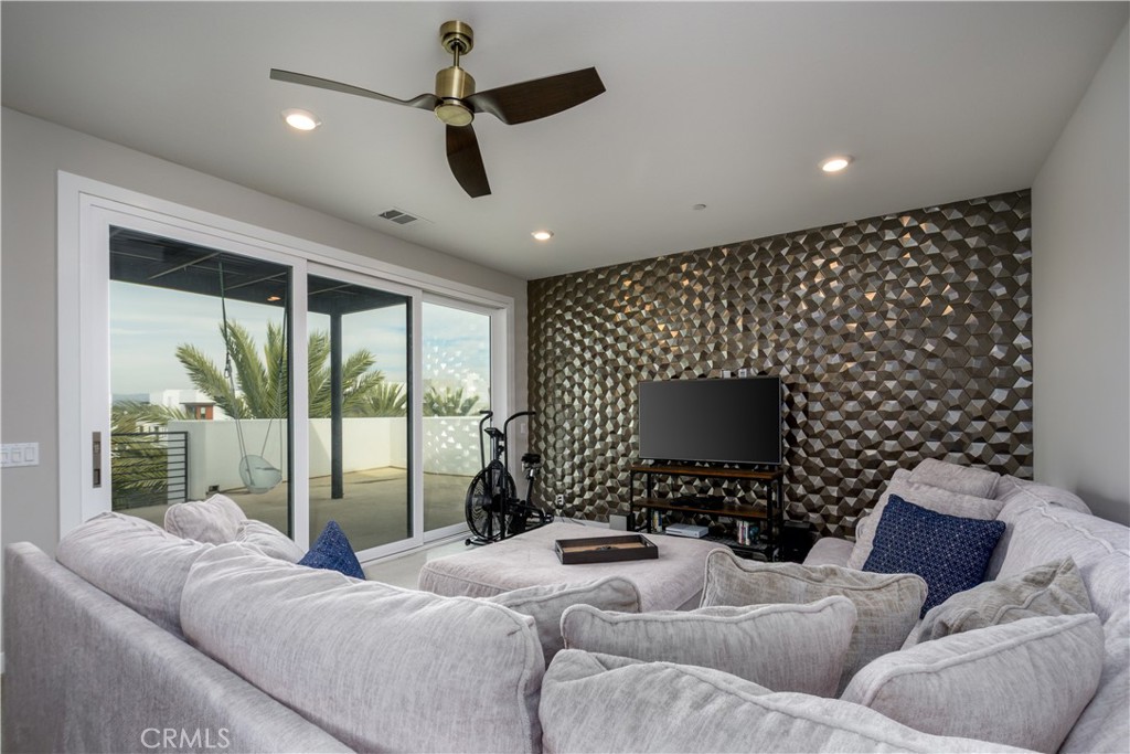 413 Transport Tustin, CA 92782 - Photo 35 of 47 a living room with furniture and a flat screen tv