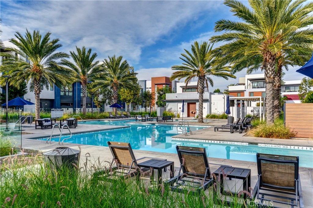 413 Transport Tustin, CA 92782 - Photo 44 of 49 a swimming pool with outdoor seating and yard