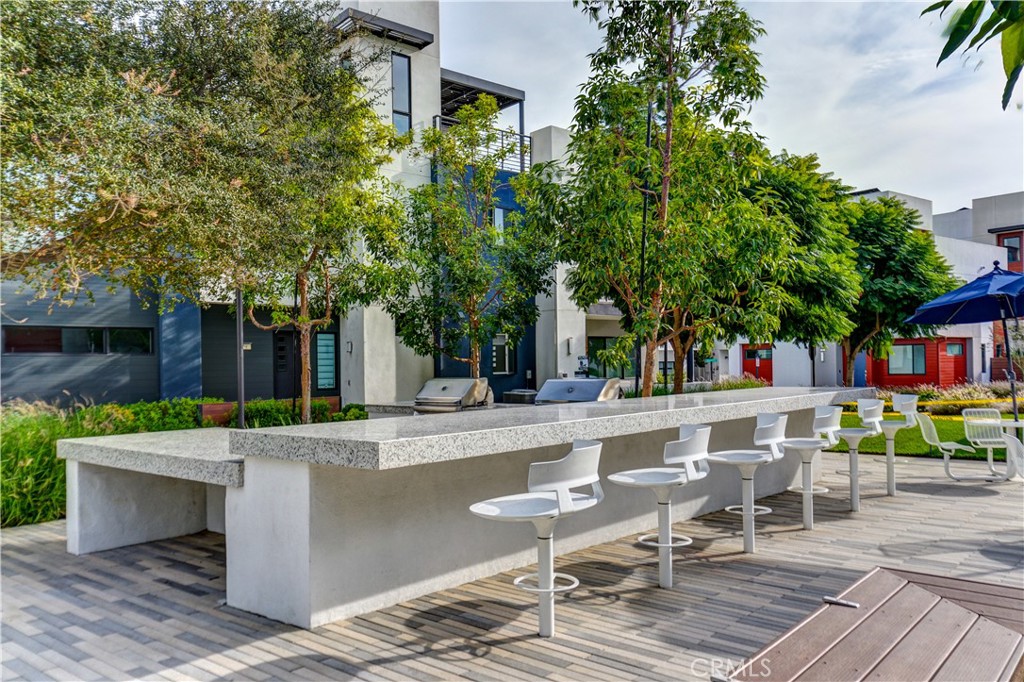 413 Transport Tustin, CA 92782 - Photo 49 of 49 a view of a patio with table and chairs and potted plants