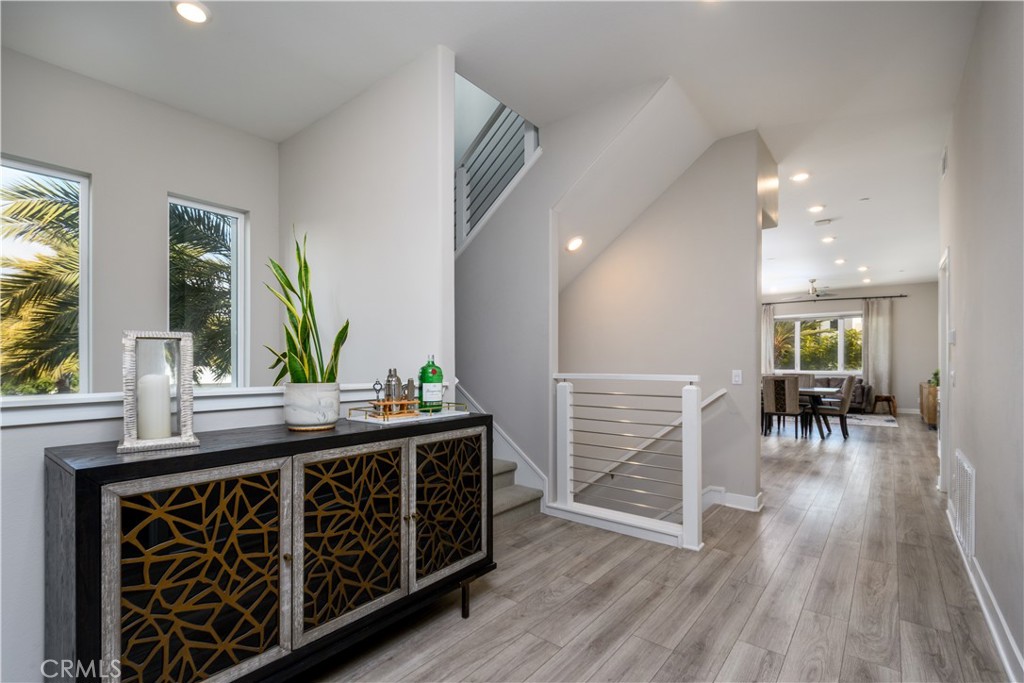 413 Transport Tustin, CA 92782 - Photo 5 of 47 a kitchen with stainless steel appliances granite countertop a stove and a wooden floors