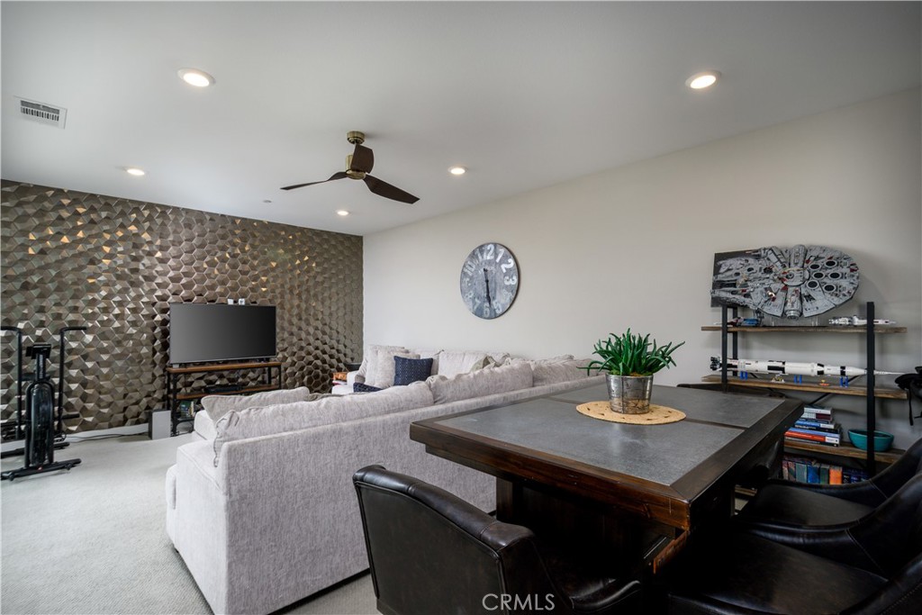 413 Transport Tustin, CA 92782 - Photo 9 of 49 a living room with furniture and a flat screen tv