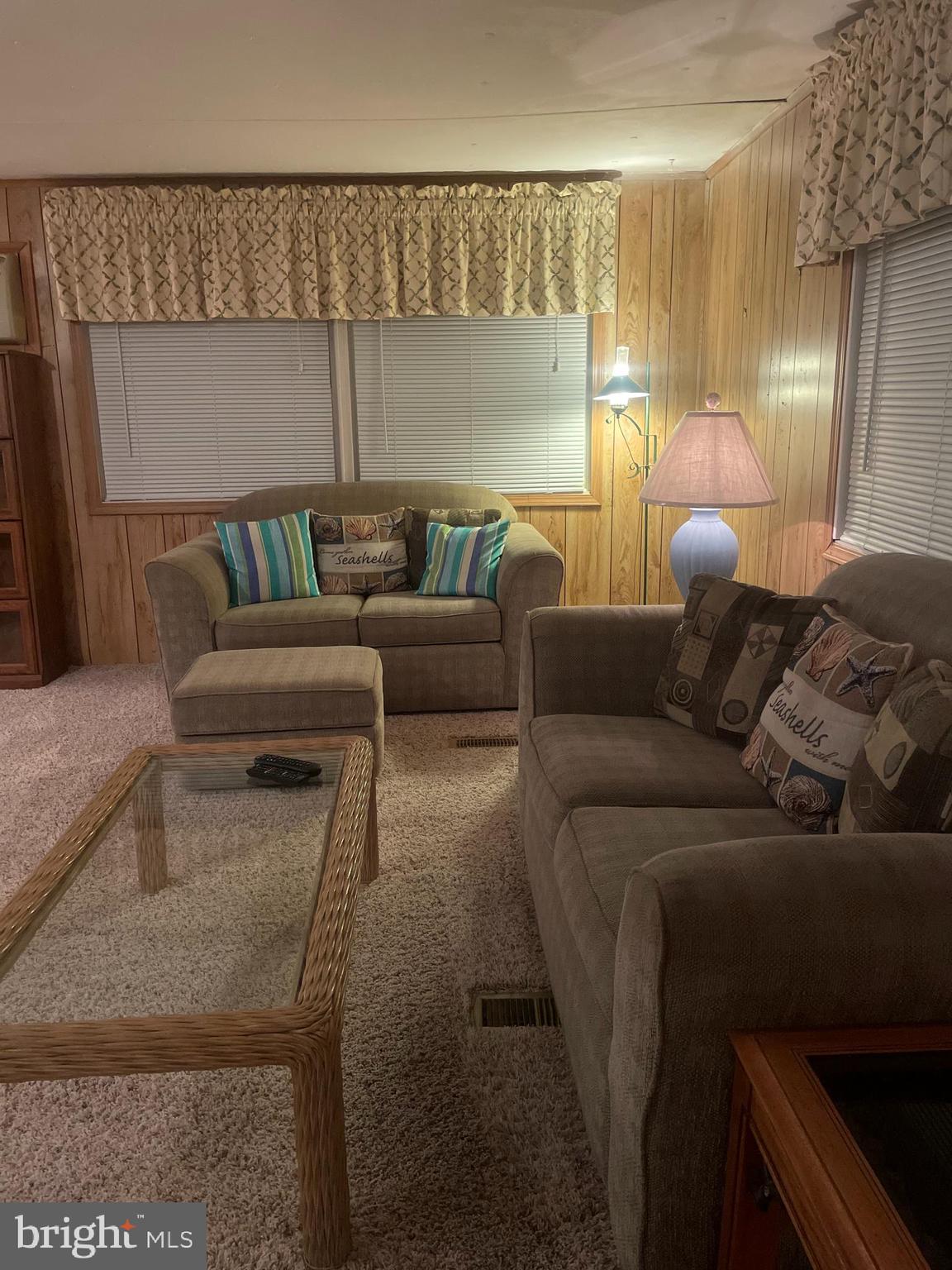 131-25 Priest Boulevard Rio Grande, NJ 08242 - Photo 12 of 35 a living room with a couch and a table