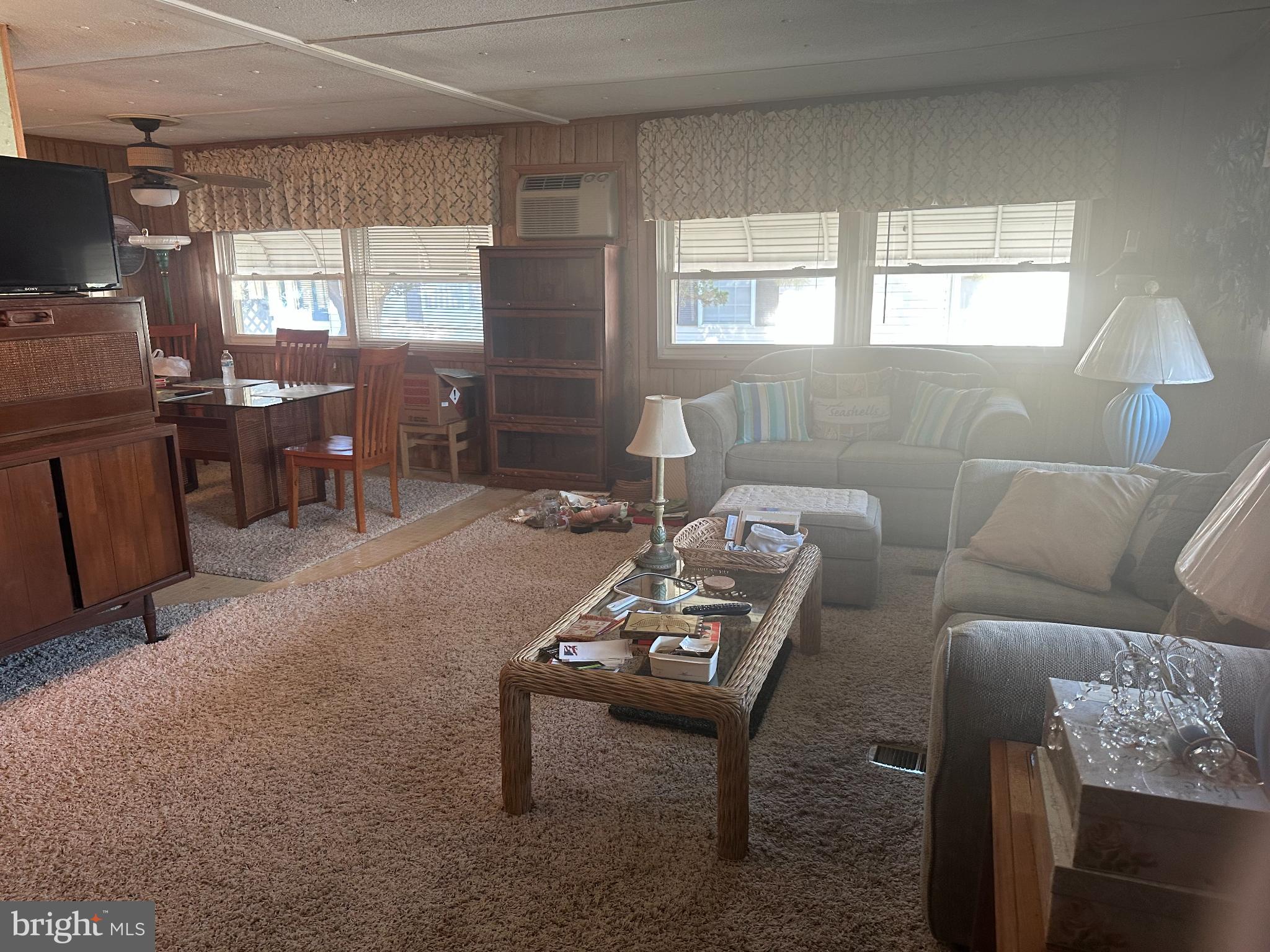 131-25 Priest Boulevard Rio Grande, NJ 08242 - Photo 13 of 35 a living room with furniture a window and a table