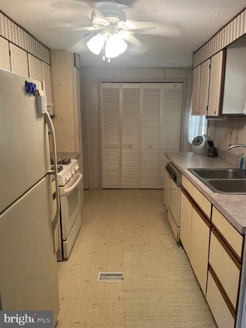131-25 Priest Boulevard Rio Grande, NJ 08242 - Photo 16 of 35 a kitchen with a sink and cabinets