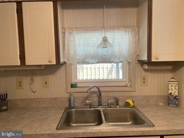 131-25 Priest Boulevard Rio Grande, NJ 08242 - Photo 18 of 35 a kitchen with a sink a window and cabinets