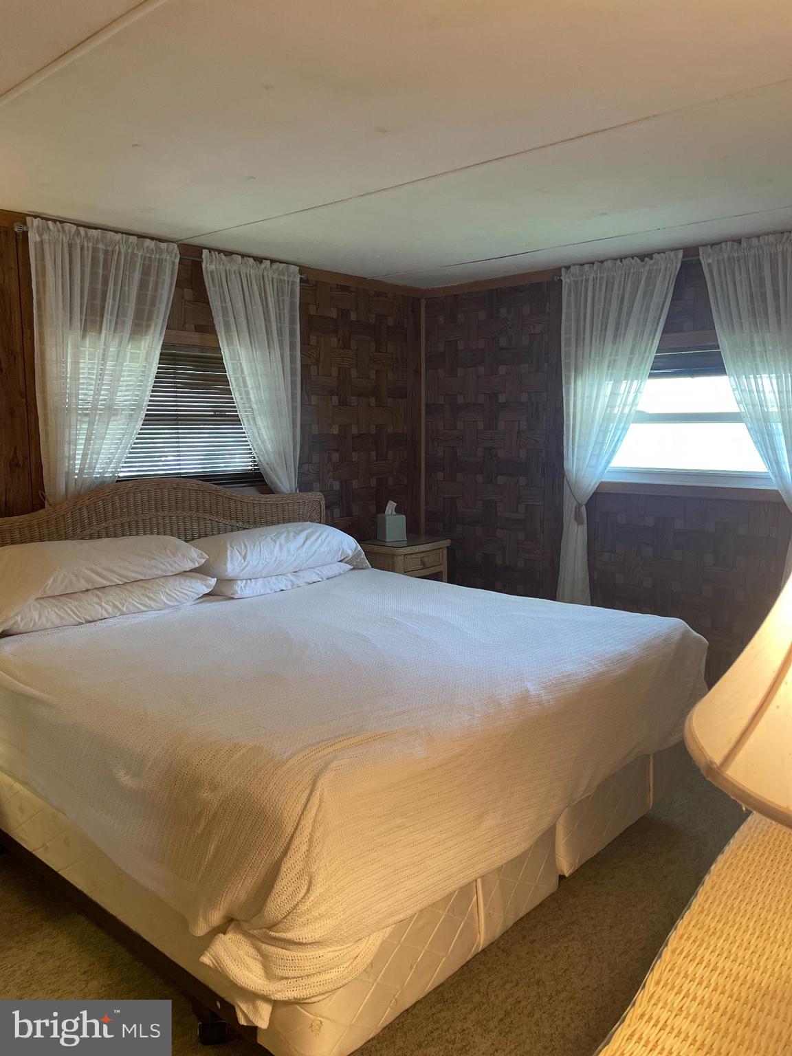 131-25 Priest Boulevard Rio Grande, NJ 08242 - Photo 19 of 35 a bedroom with a bed and a window