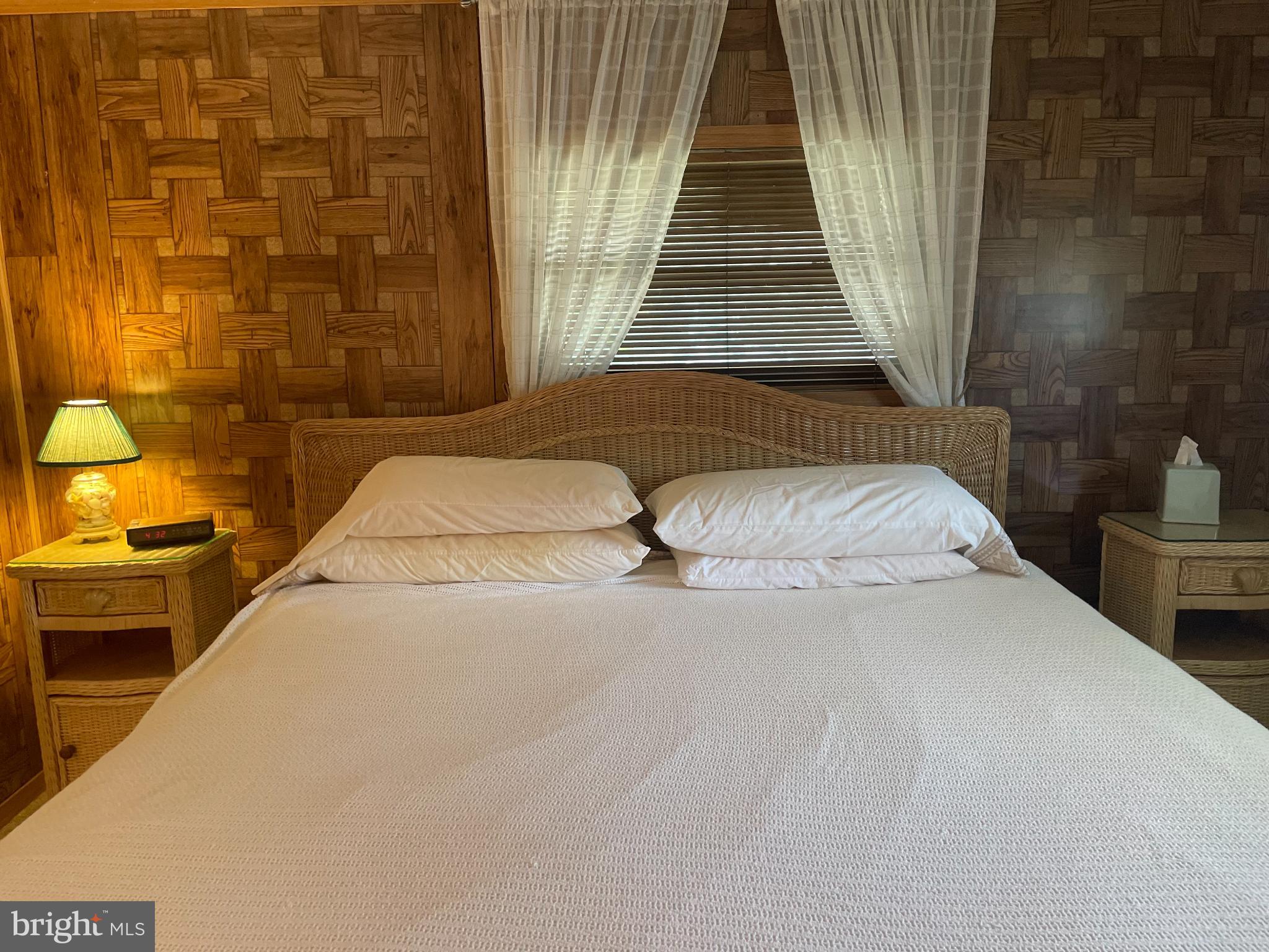 131-25 Priest Boulevard Rio Grande, NJ 08242 - Photo 21 of 35 a bedroom with a bed and a table