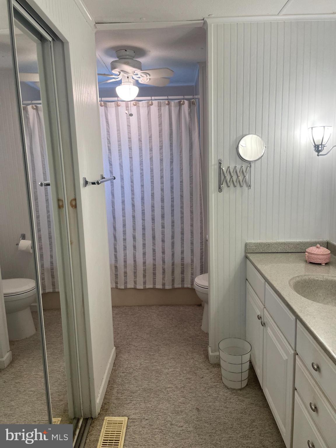 131-25 Priest Boulevard Rio Grande, NJ 08242 - Photo 23 of 35 a bathroom with a sink and a mirror
