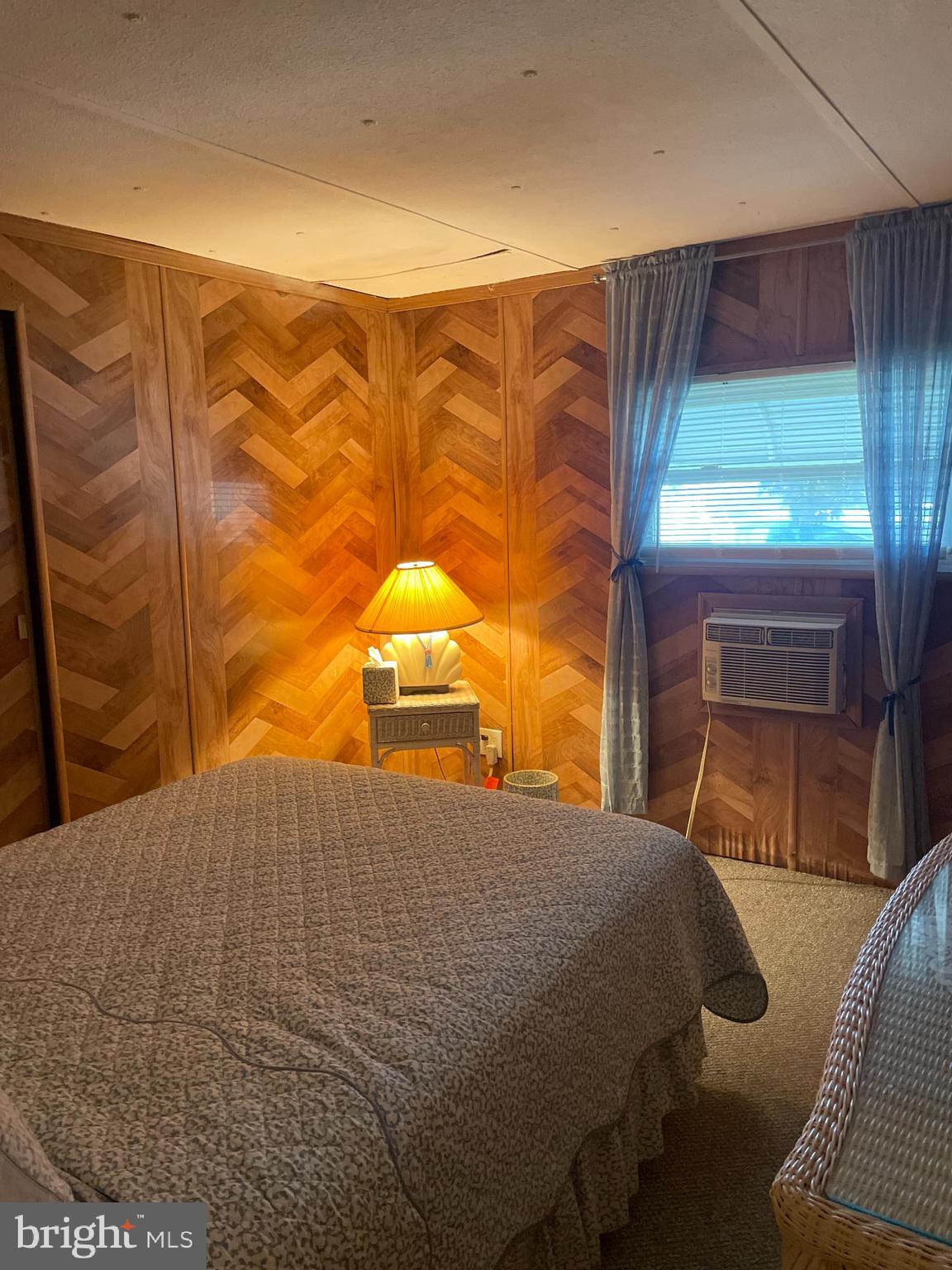 131-25 Priest Boulevard Rio Grande, NJ 08242 - Photo 26 of 35 a bedroom with a bed and a window