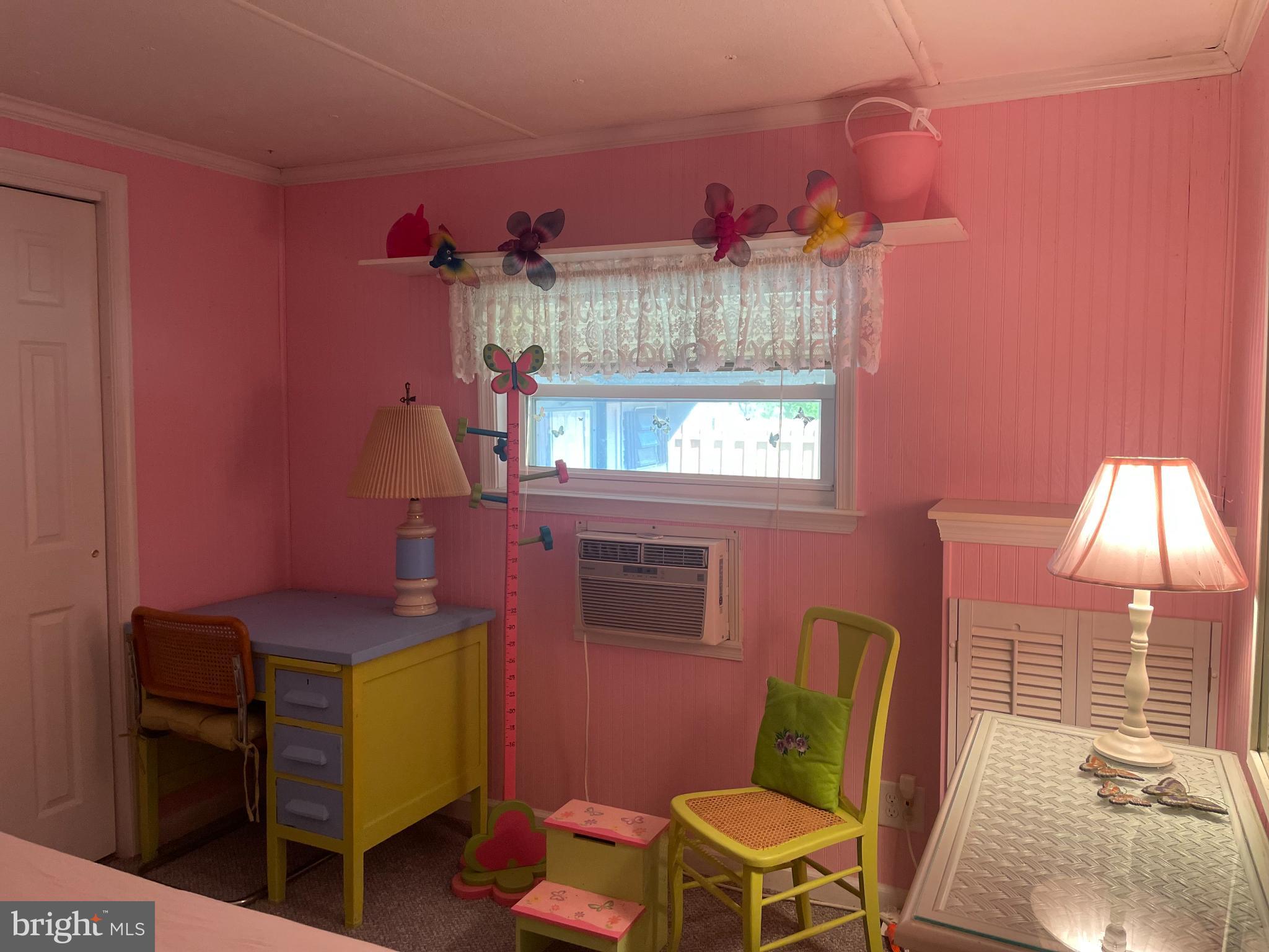 131-25 Priest Boulevard Rio Grande, NJ 08242 - Photo 29 of 35 a room with a chair and a window