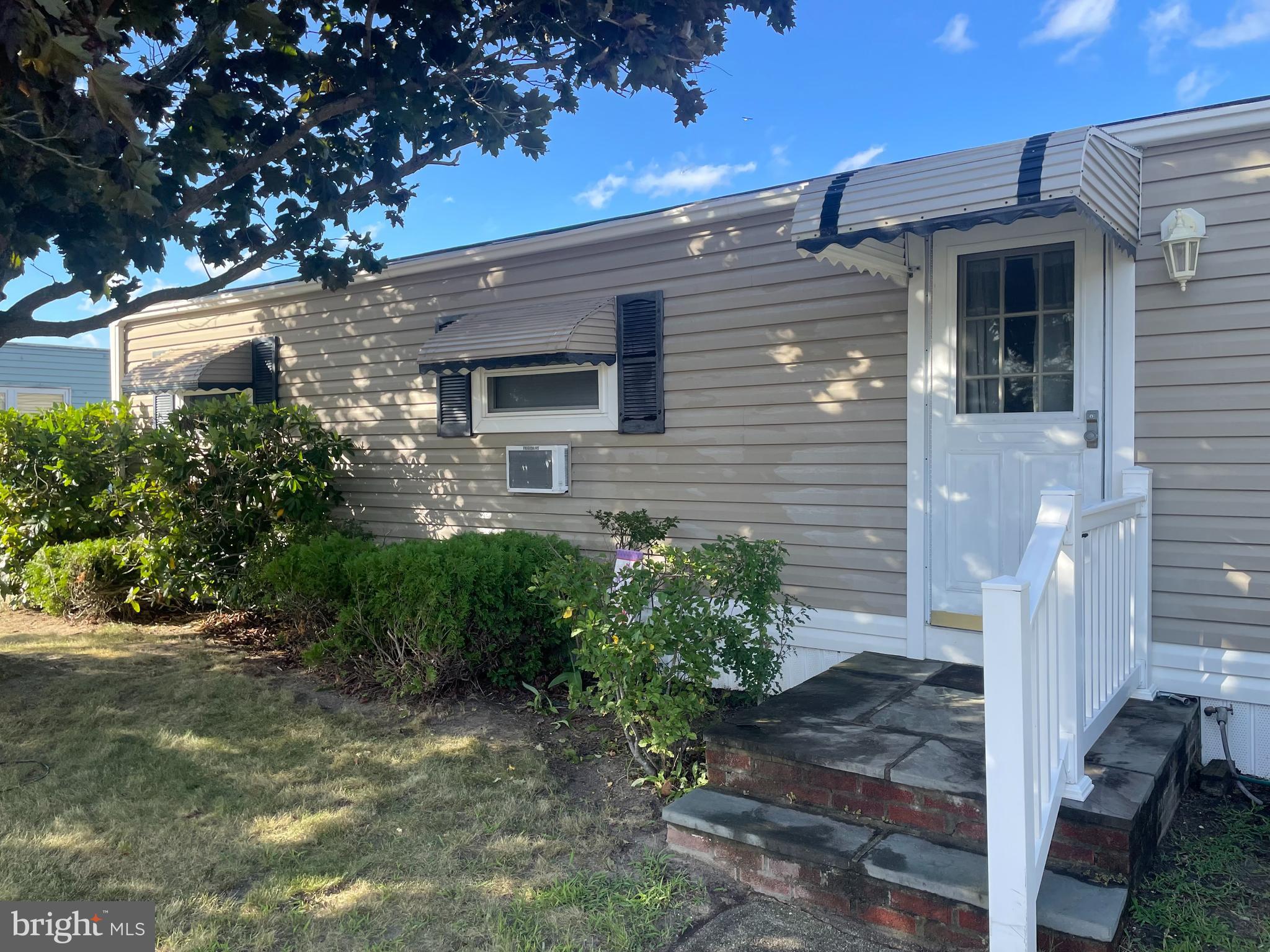 131-25 Priest Boulevard Rio Grande, NJ 08242 - Photo 3 of 35 a front view of a house with garden
