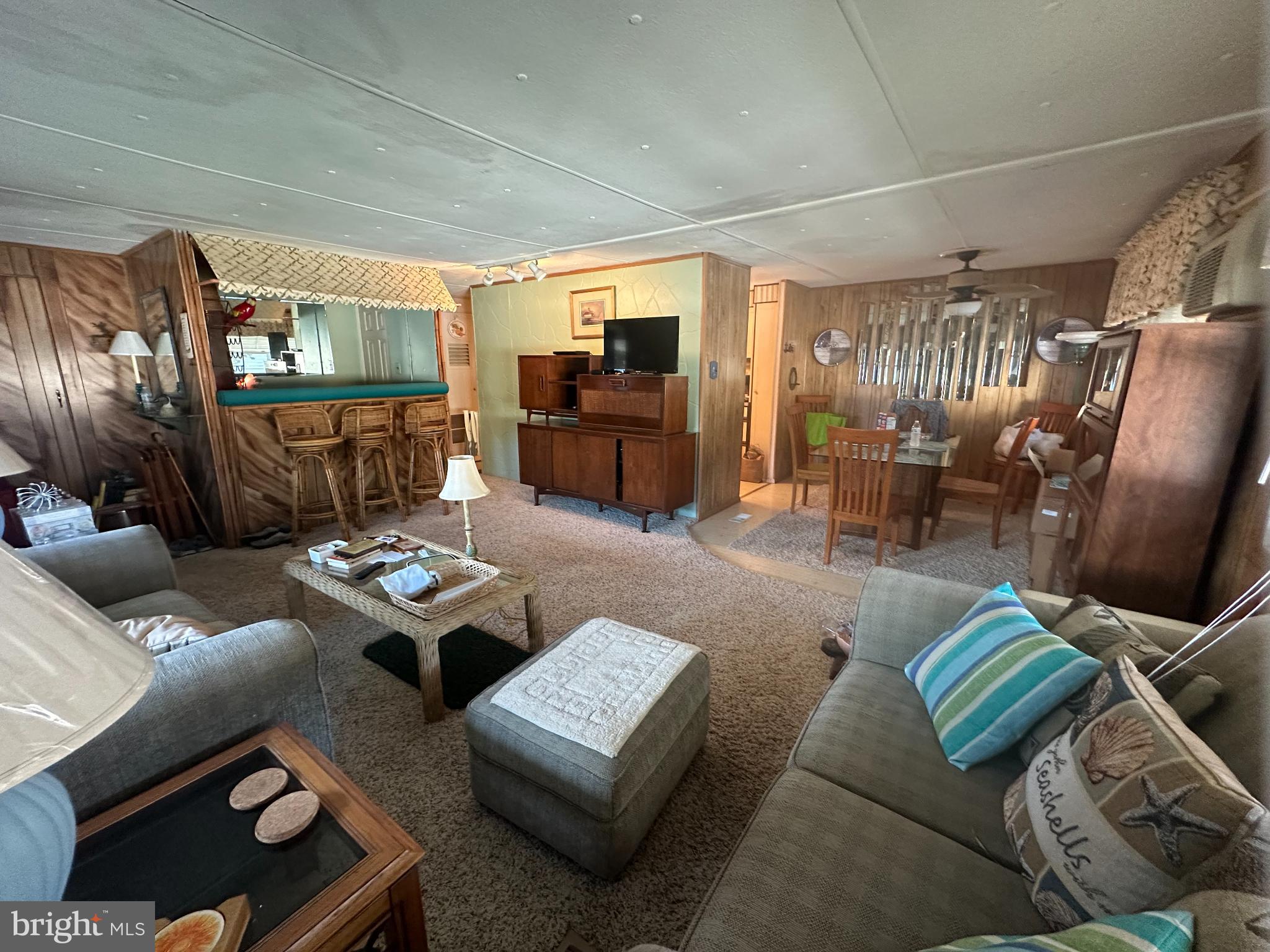 131-25 Priest Boulevard Rio Grande, NJ 08242 - Photo 6 of 35 a living room with furniture and a flat screen tv