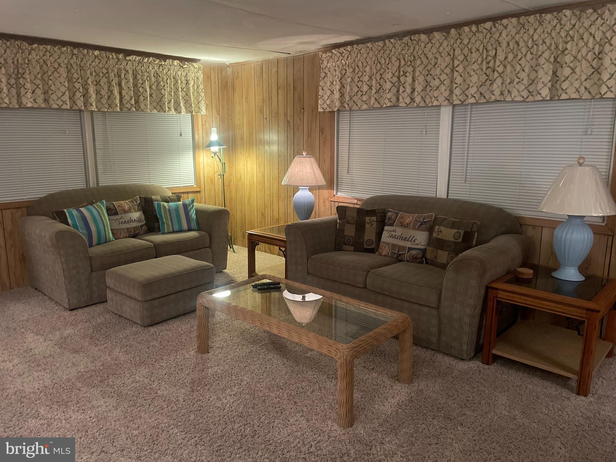 131-25 Priest Boulevard Rio Grande, NJ 08242 - Photo 7 of 35 a living room with furniture and a lamp