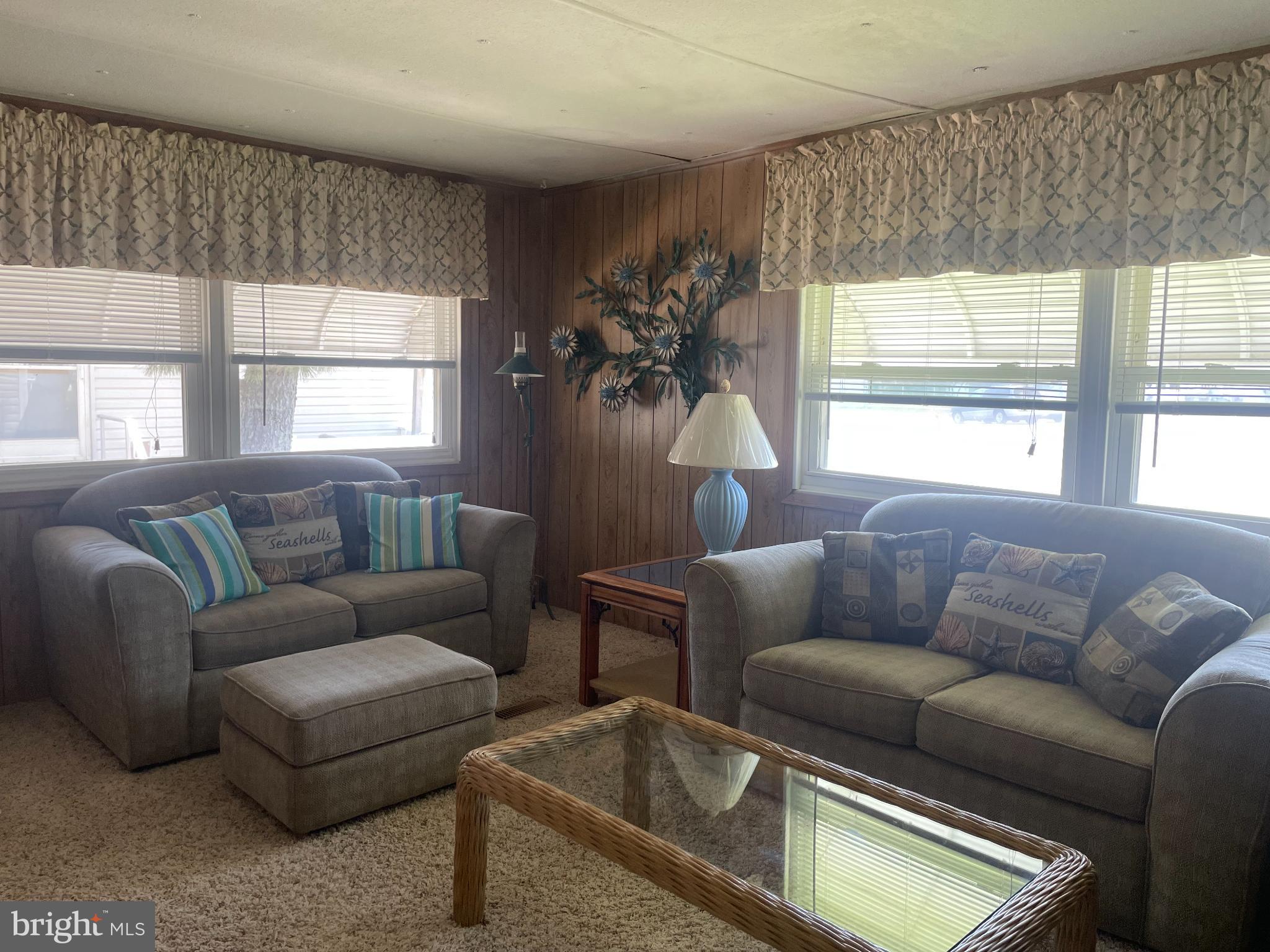 131-25 Priest Boulevard Rio Grande, NJ 08242 - Photo 8 of 35 a living room with furniture and a large window