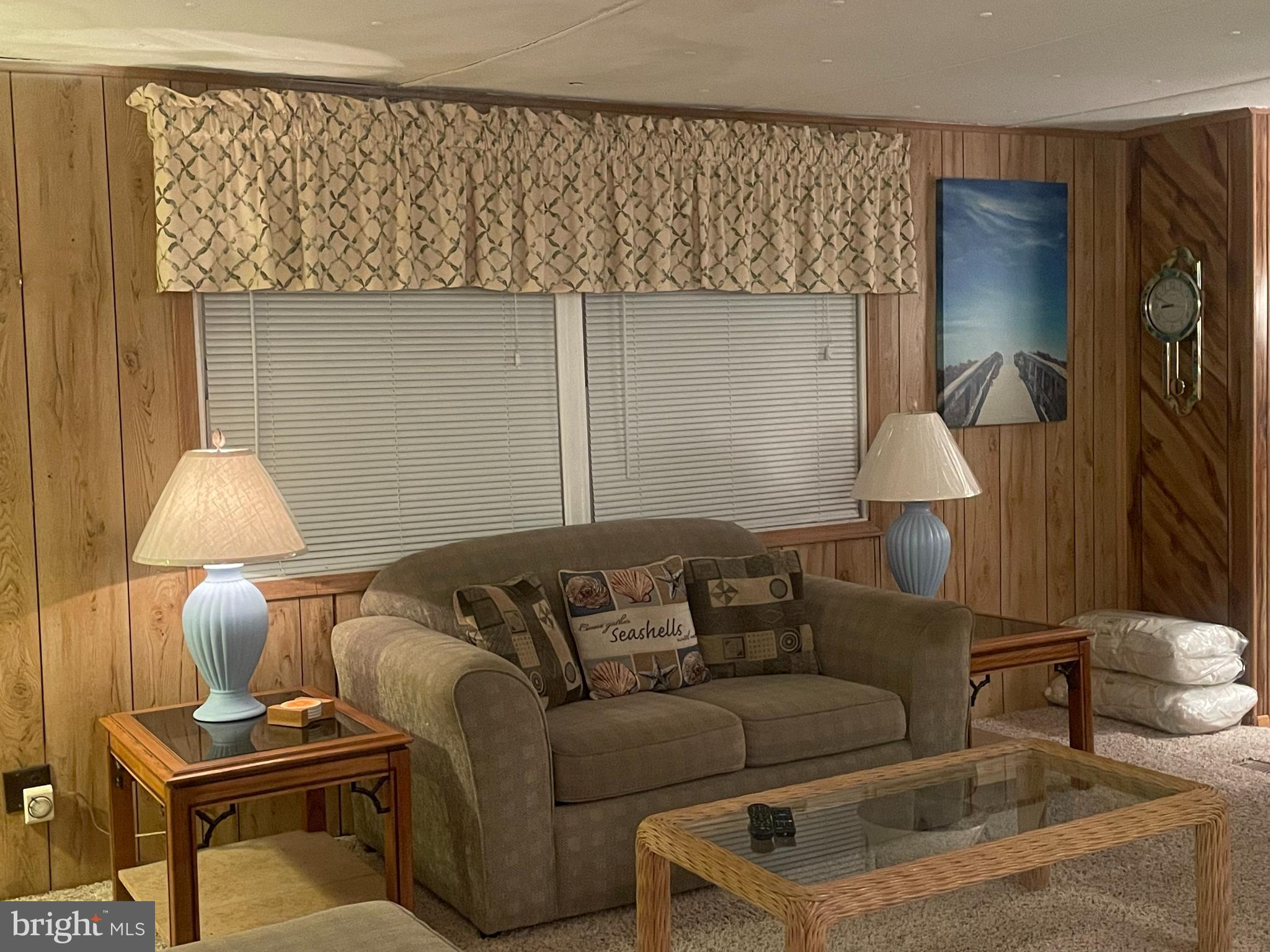 131-25 Priest Boulevard Rio Grande, NJ 08242 - Photo 9 of 35 a living room with furniture and a lamp