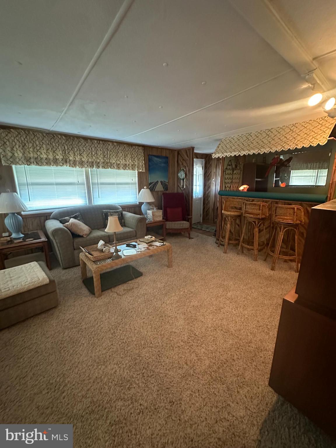131-25 Priest Boulevard Rio Grande, NJ 08242 - Photo 10 of 35 a living room with furniture and a table