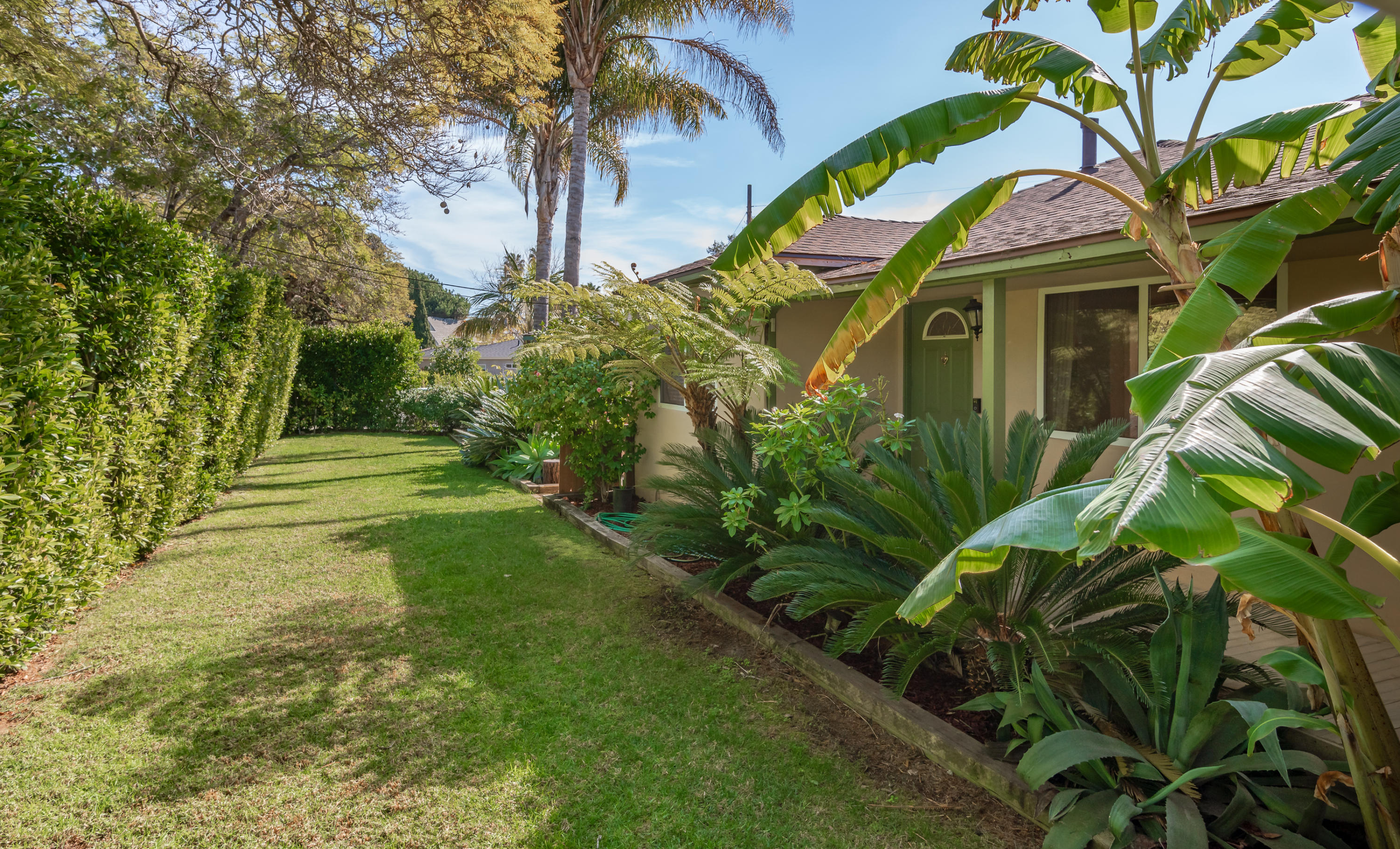 2139 Modoc Road Santa Barbara, CA 93101 - Photo 15 of 19 Private yard with large hedge