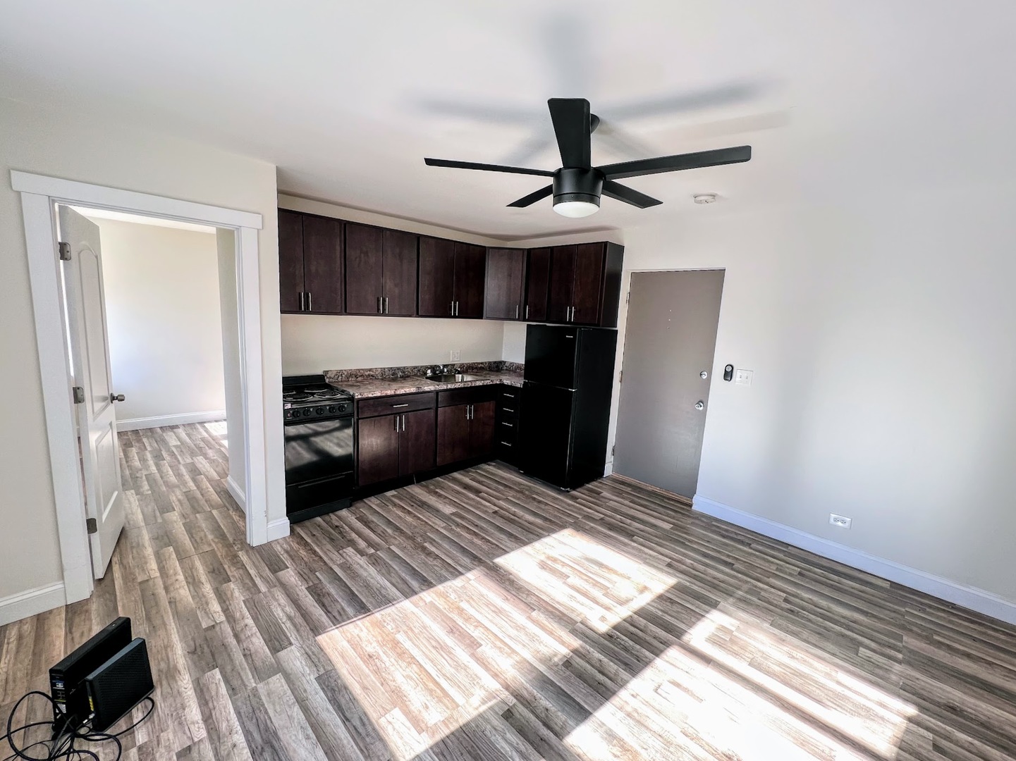 3933 North Clarendon Avenue, Unit 507 Chicago, IL 60613 - Photo 6 of 12 a bedroom with a bed and a dresser