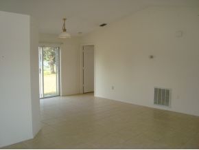 1836 Northeast Cleveland Palm Bay, FL 32905 - Photo 2 of 7 an empty room with windows and closet