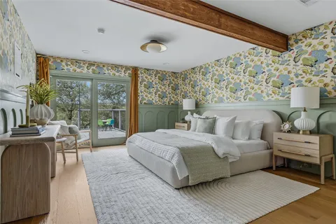a spacious bedroom with a large bed and a large window