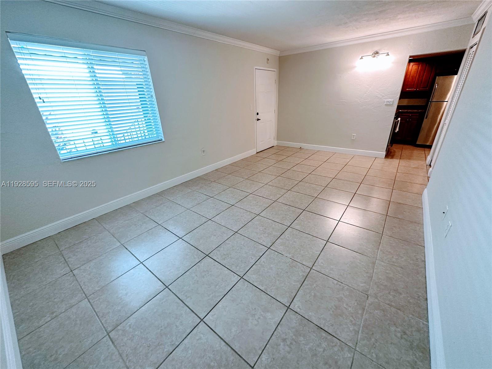 8603 Southwest 68th Court, Unit 26 Pinecrest, FL 33156 - Photo 3 of 13 a view of a livingroom with window