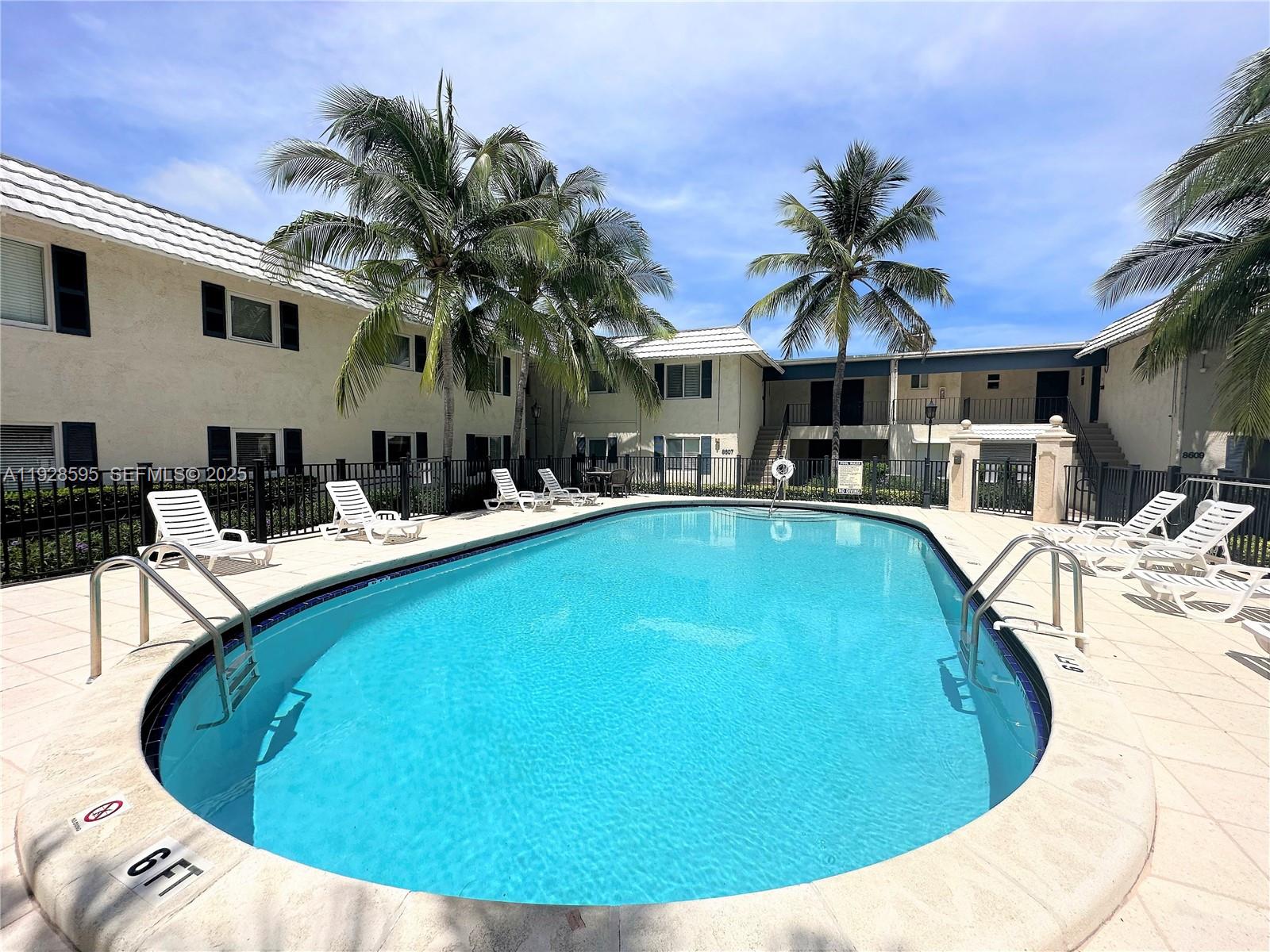 8603 Southwest 68th Court, Unit 26 Pinecrest, FL 33156 - Photo 8 of 13 a view of outdoor space yard swimming pool and porch