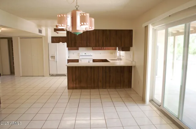 a view of a room with wooden floor fan and window