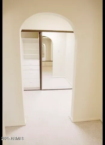 a bathroom with a shower and a glass door