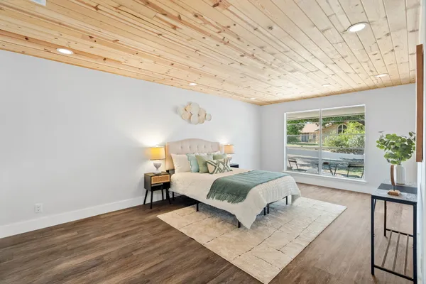 a bedroom with furniture and a potted plant