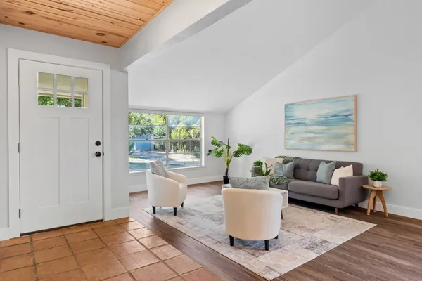 a living room with furniture and a window