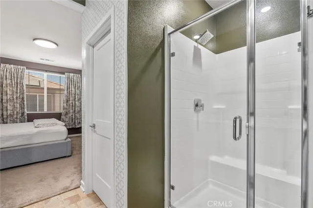 a bathroom with a white tub shower vanity and a sink