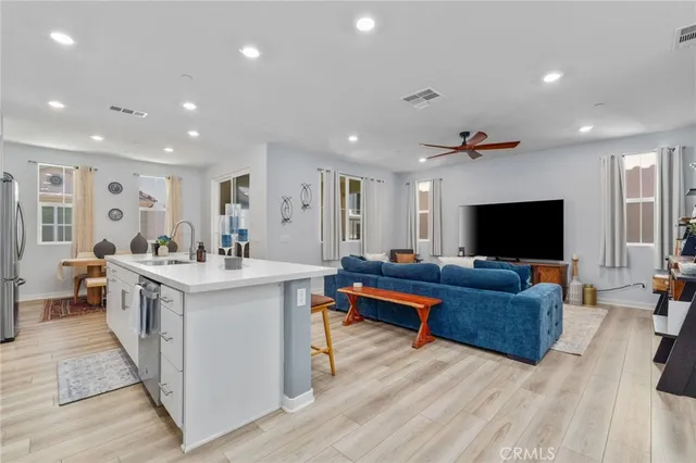 a living room with furniture and flat screen tv