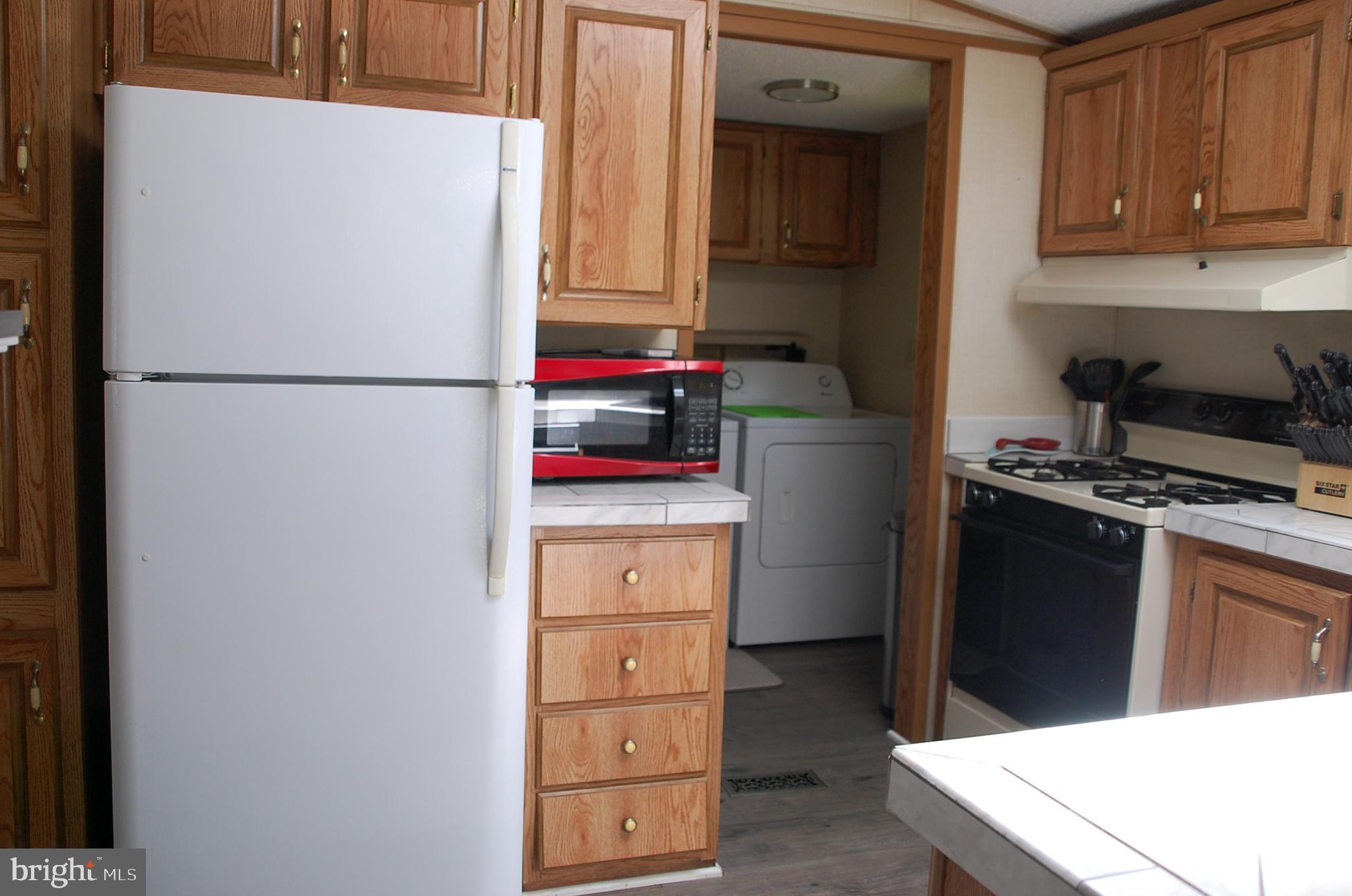 10505 Cedarville Road Brandywine, MD 20613 - Photo 18 of 36 Refrigerator and view to Laundry Rm