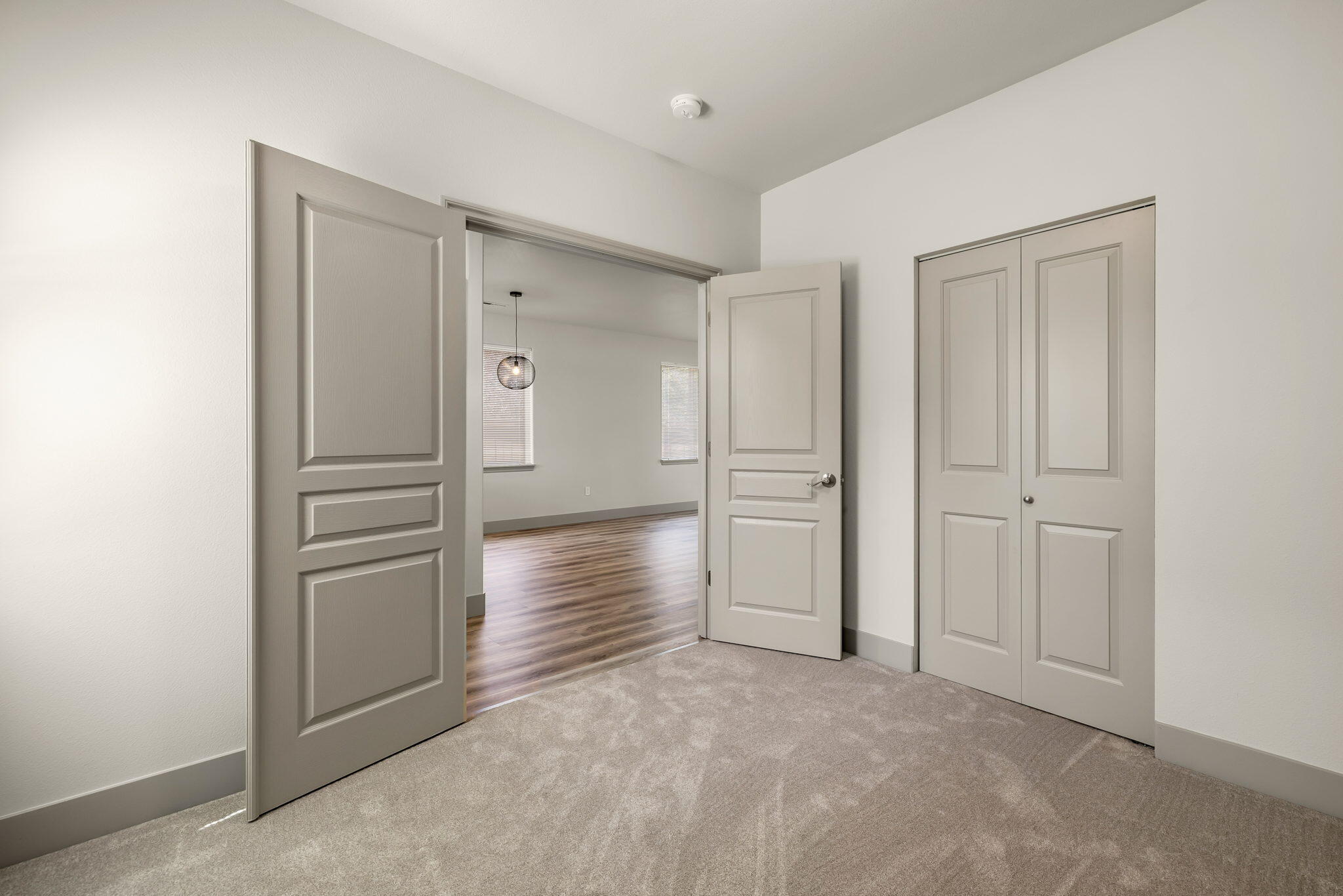 3108 Yellow Ribbon Drive Bend, OR 97701 - Photo 11 of 36 an empty room with closet and wooden door