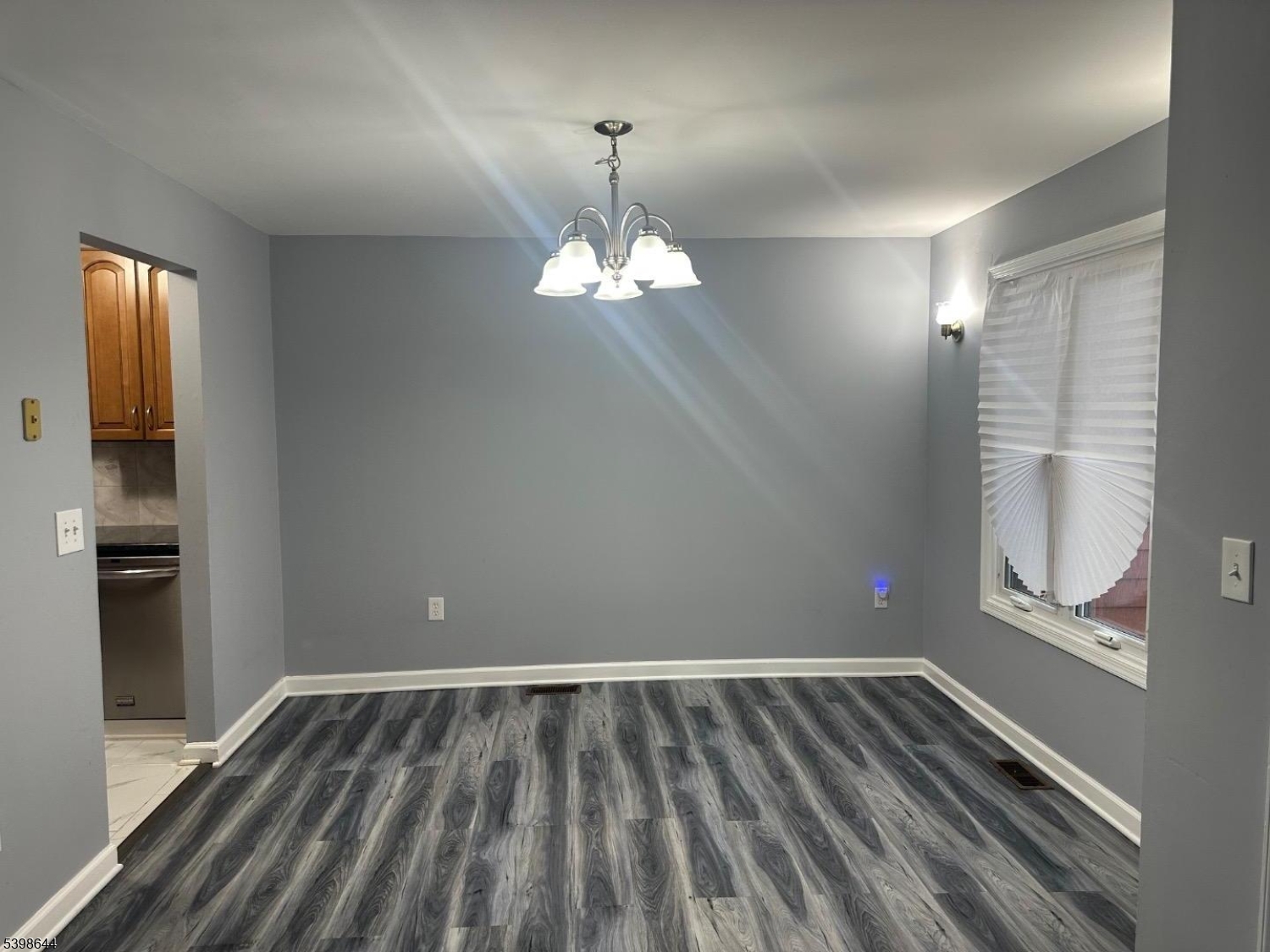 212 Village Commons Flemington, NJ 08822 - Photo 5 of 17 wooden floor in an empty room with a window