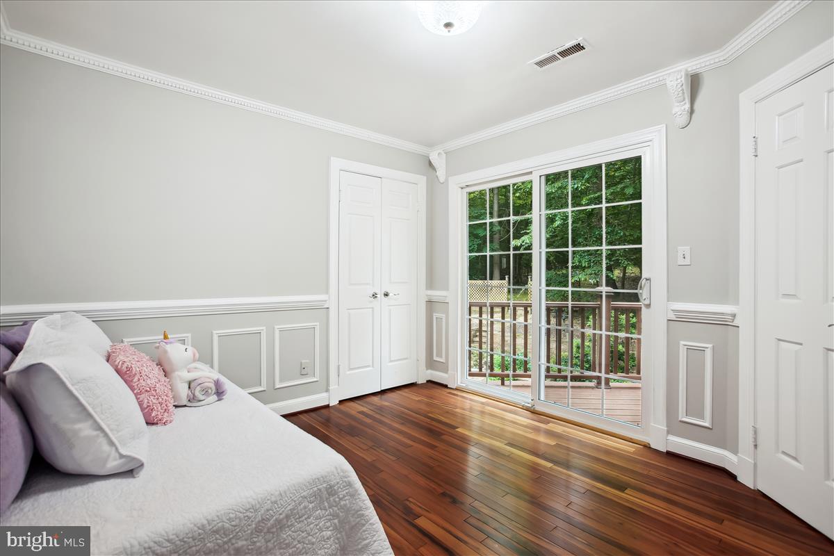 12221 Chapel Road Clifton, VA 20124 - Photo 49 of 93 $th Upper Level Bedroom with Slider to Deck.