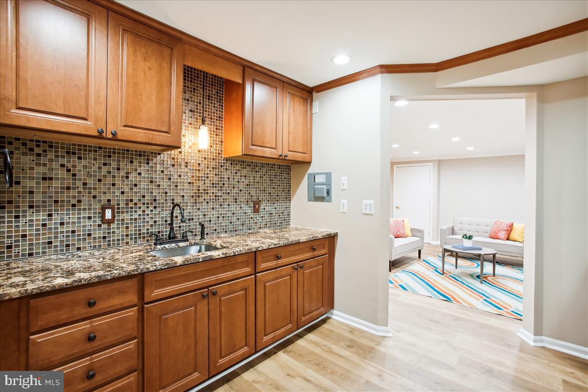 12221 Chapel Road Clifton, VA 20124 - Photo 62 of 93 Lower Level Kitchenette with Mosaic Backsplash.