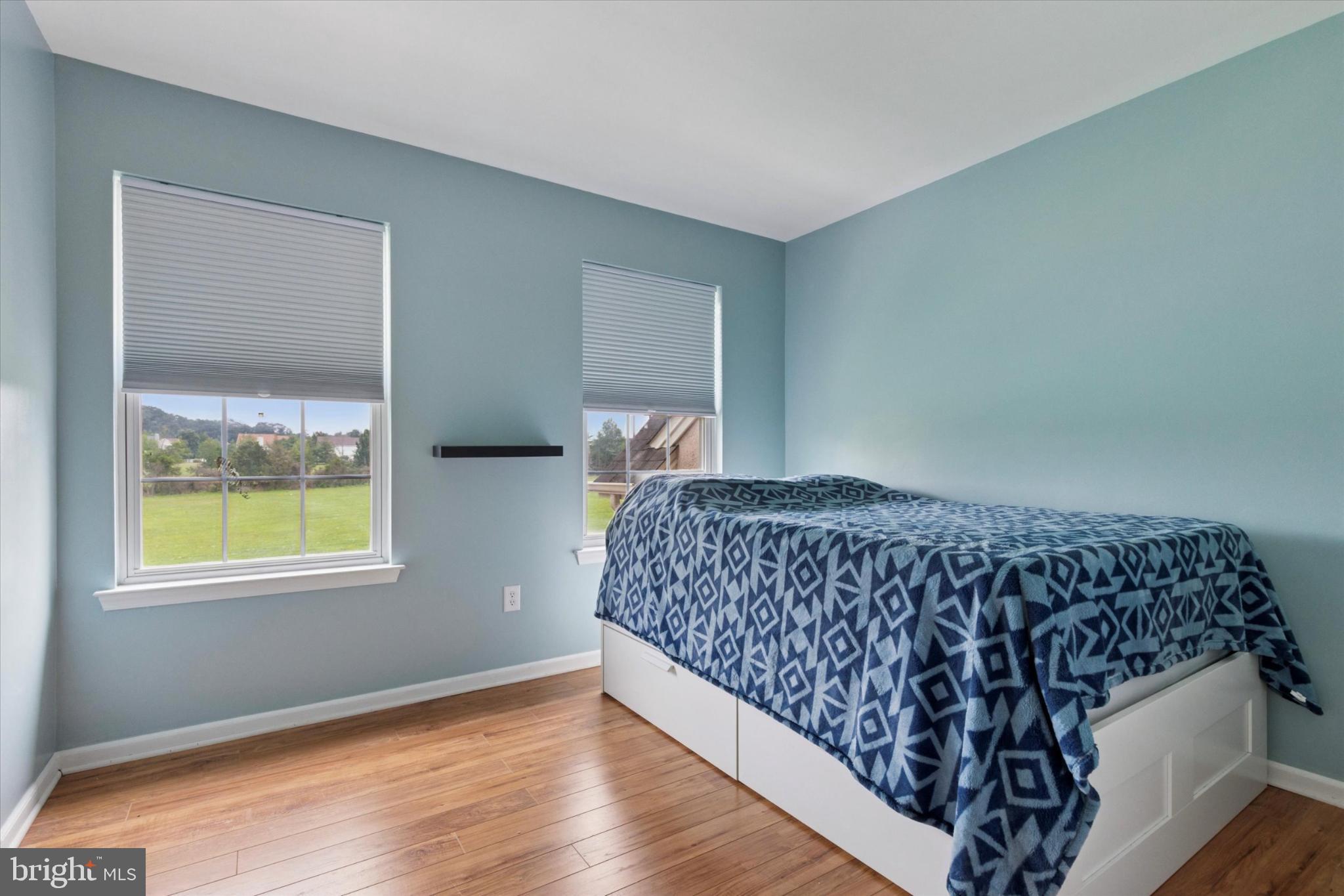 227 Beech Lane Perkasie, PA 18944 - Photo 24 of 34 Serene bedroom with scenic outdoor views.