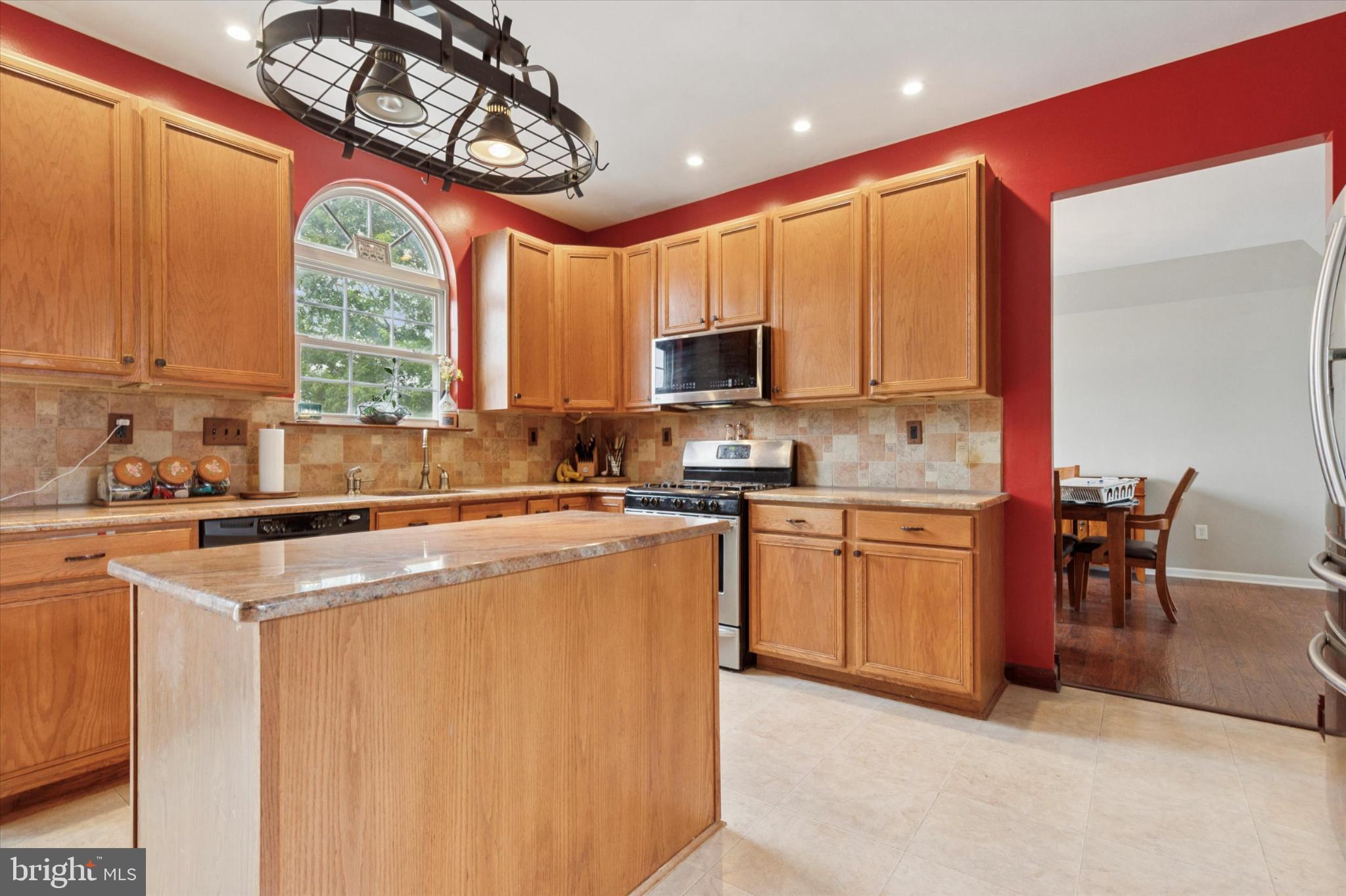 227 Beech Lane Perkasie, PA 18944 - Photo 7 of 34 Warm wood tones in a vibrant kitchen space.