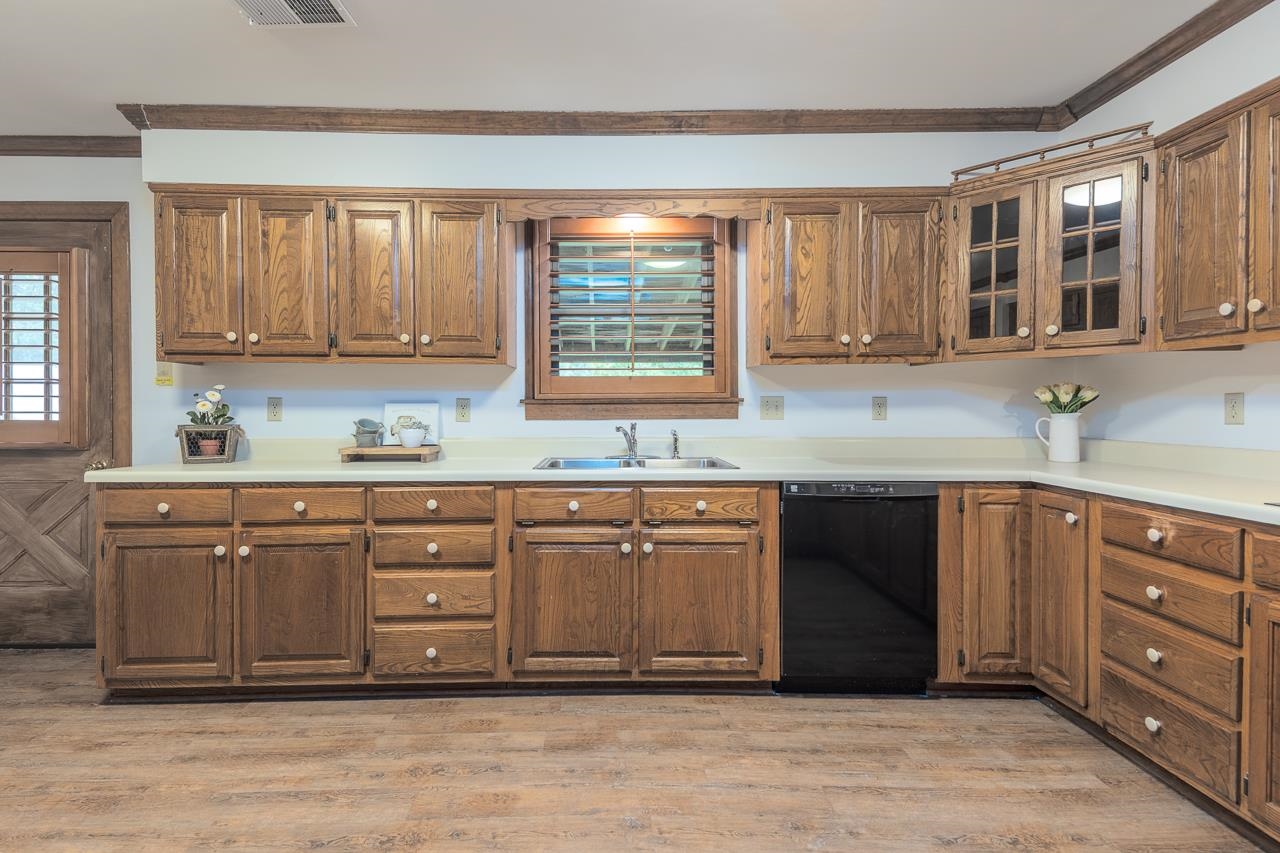 900 Center Point Drive Mason, TN 38049 - Photo 11 of 36 a kitchen with granite countertop a sink cabinets and a window