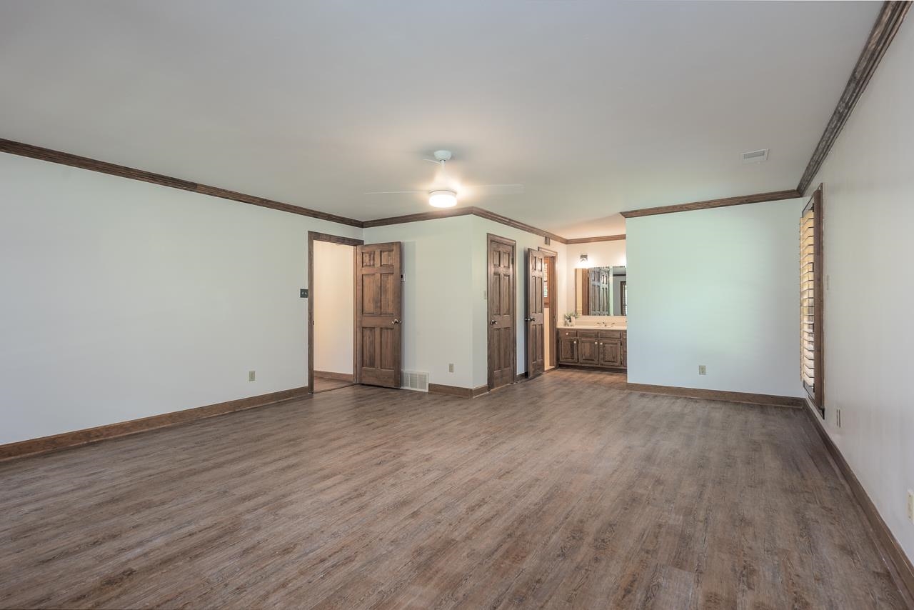 900 Center Point Drive Mason, TN 38049 - Photo 18 of 36 a view of empty room with wooden floor