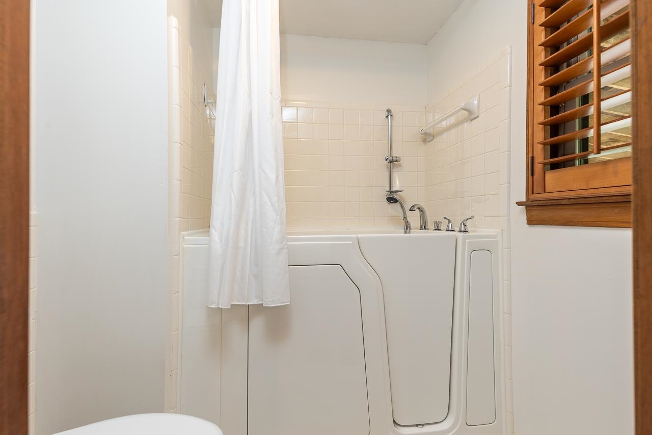 900 Center Point Drive Mason, TN 38049 - Photo 19 of 36 a bathroom with a sink and a mirror