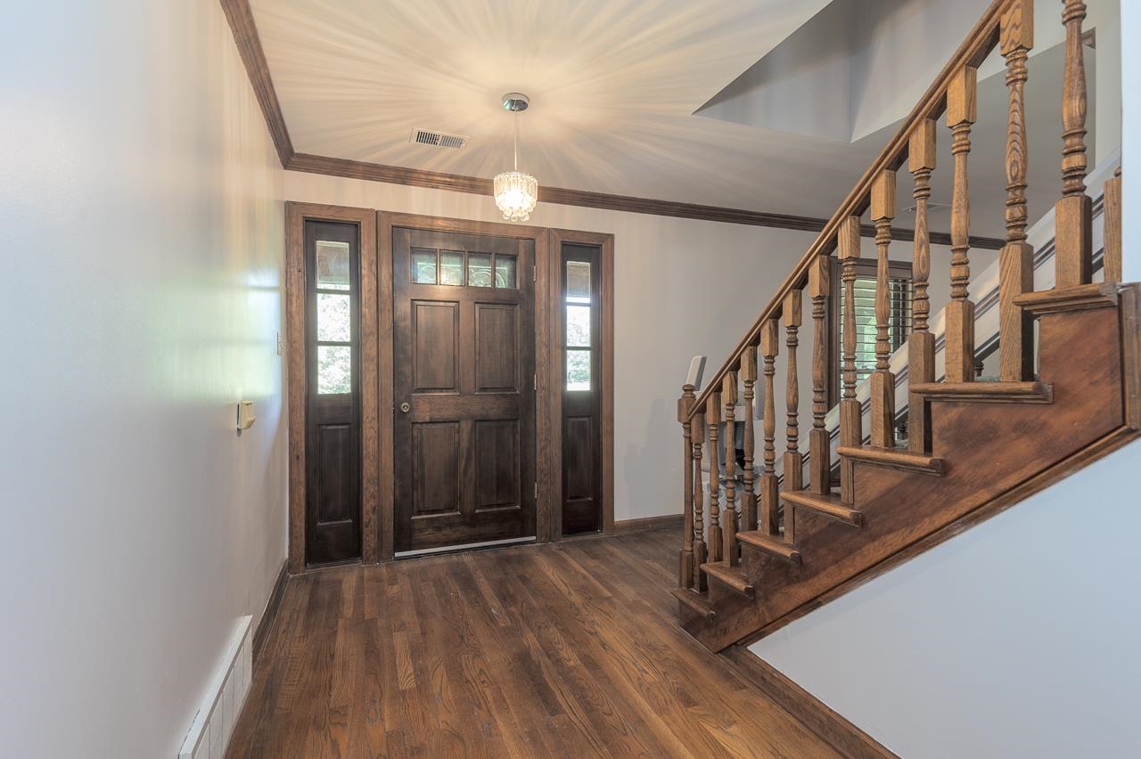 900 Center Point Drive Mason, TN 38049 - Photo 20 of 36 a view of an entryway with wooden floor and door