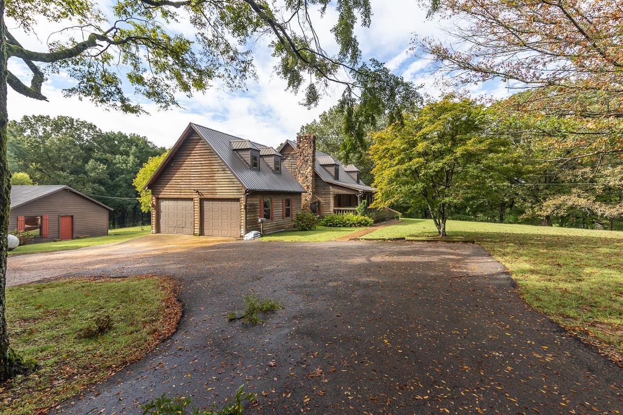 900 Center Point Drive Mason, TN 38049 - Photo 2 of 36 a view of house with yard and street view