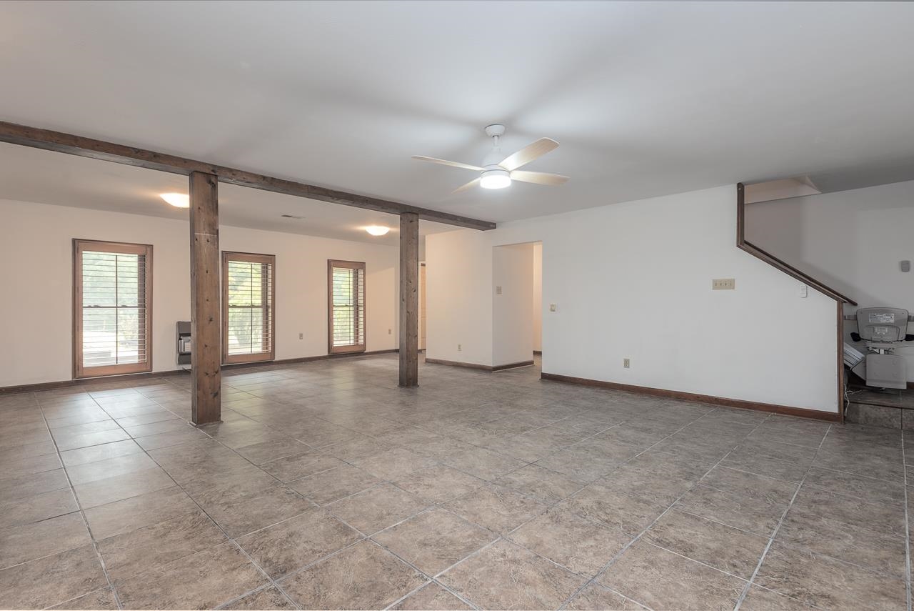 900 Center Point Drive Mason, TN 38049 - Photo 22 of 36 an empty room with windows and pillars in it